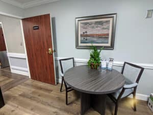 Edisto Post Acute room with round table and chairs