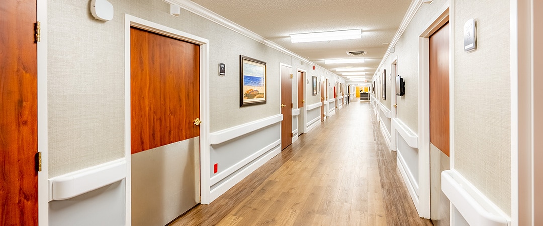 edisto post acute hallway with paintings hanging on the wall
